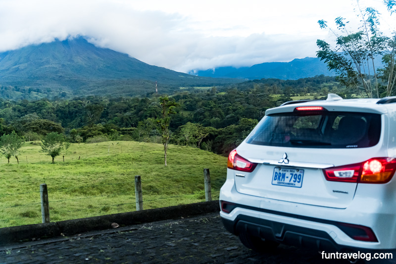 A rental car with a view of Arenal volcano