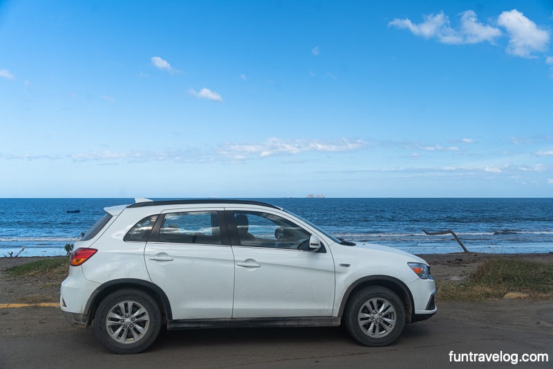 A car in front of a beach in Guanacaste province, Costa Rica